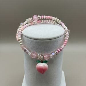 Pink Beaded Bracelet with Peach Charm